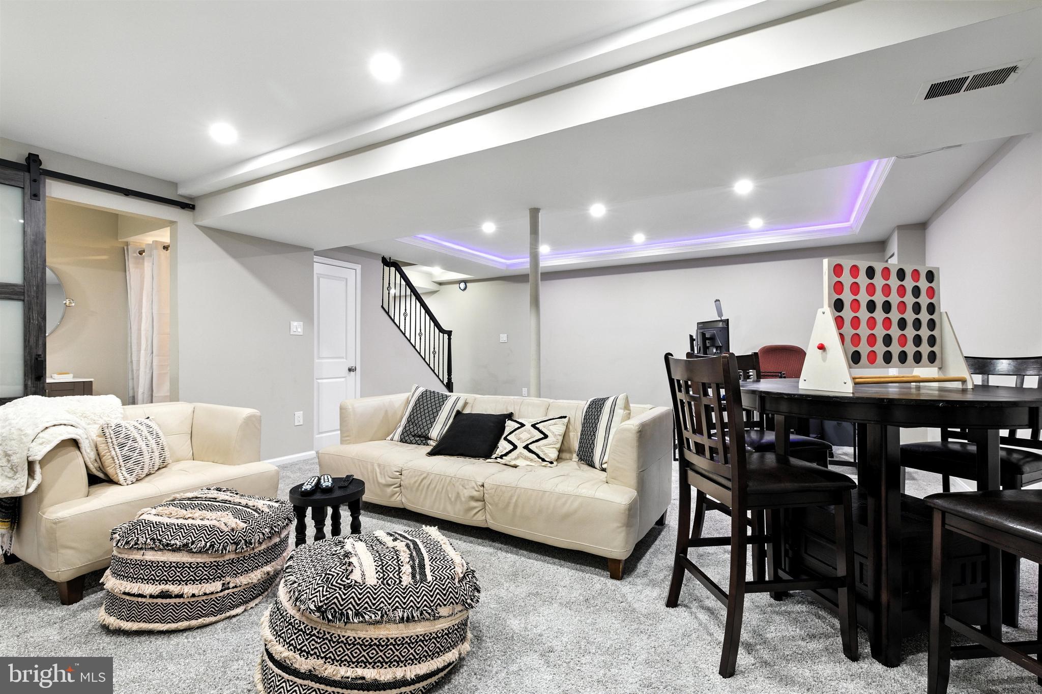 21804 Goshen School Road Gaithersburg, MD 20882 - Photo 16 of 37 a living room with furniture and a rug