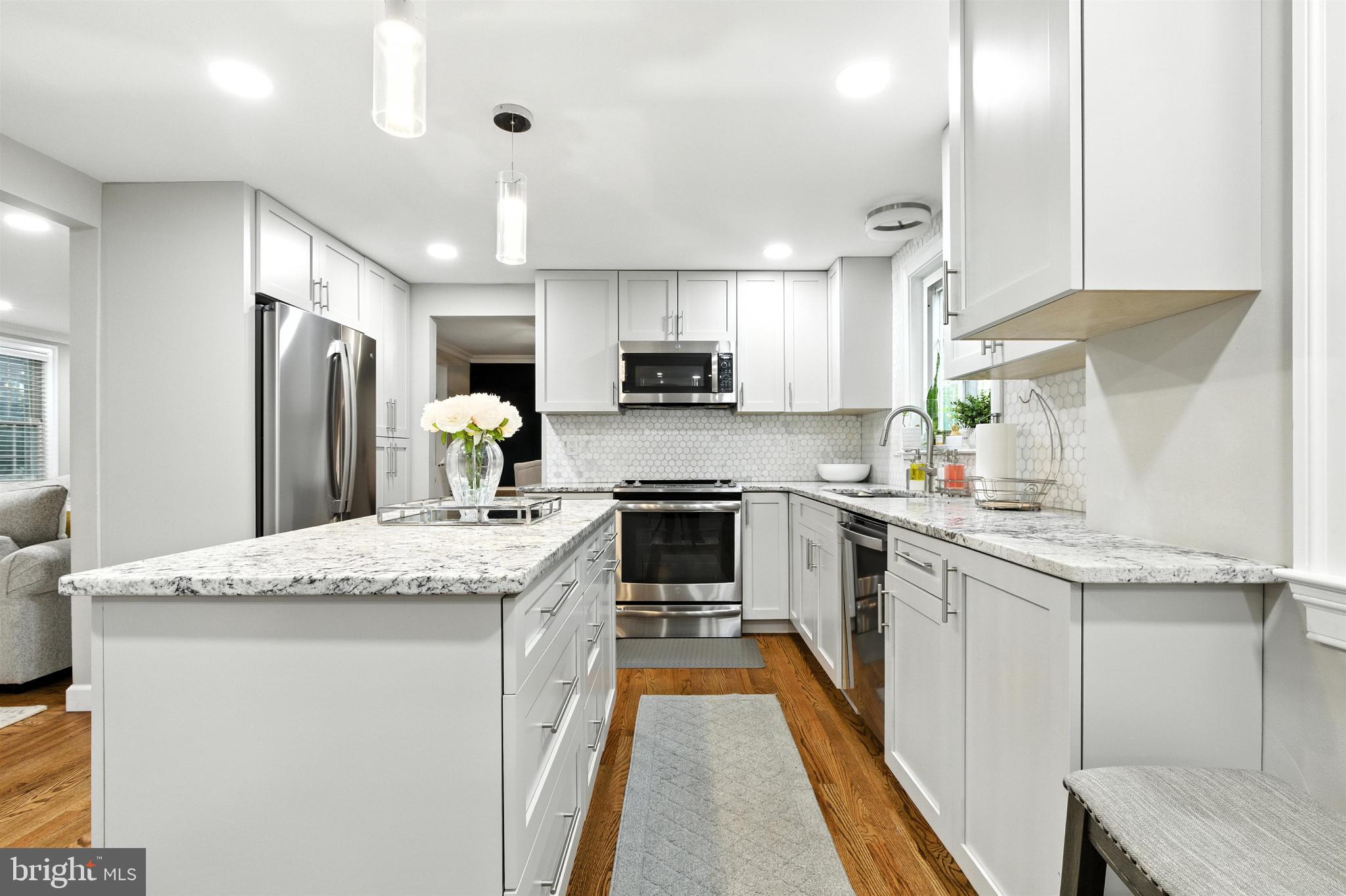 21804 Goshen School Road Gaithersburg, MD 20882 - Photo 2 of 37 a kitchen with stainless steel appliances granite countertop a sink stove and refrigerator