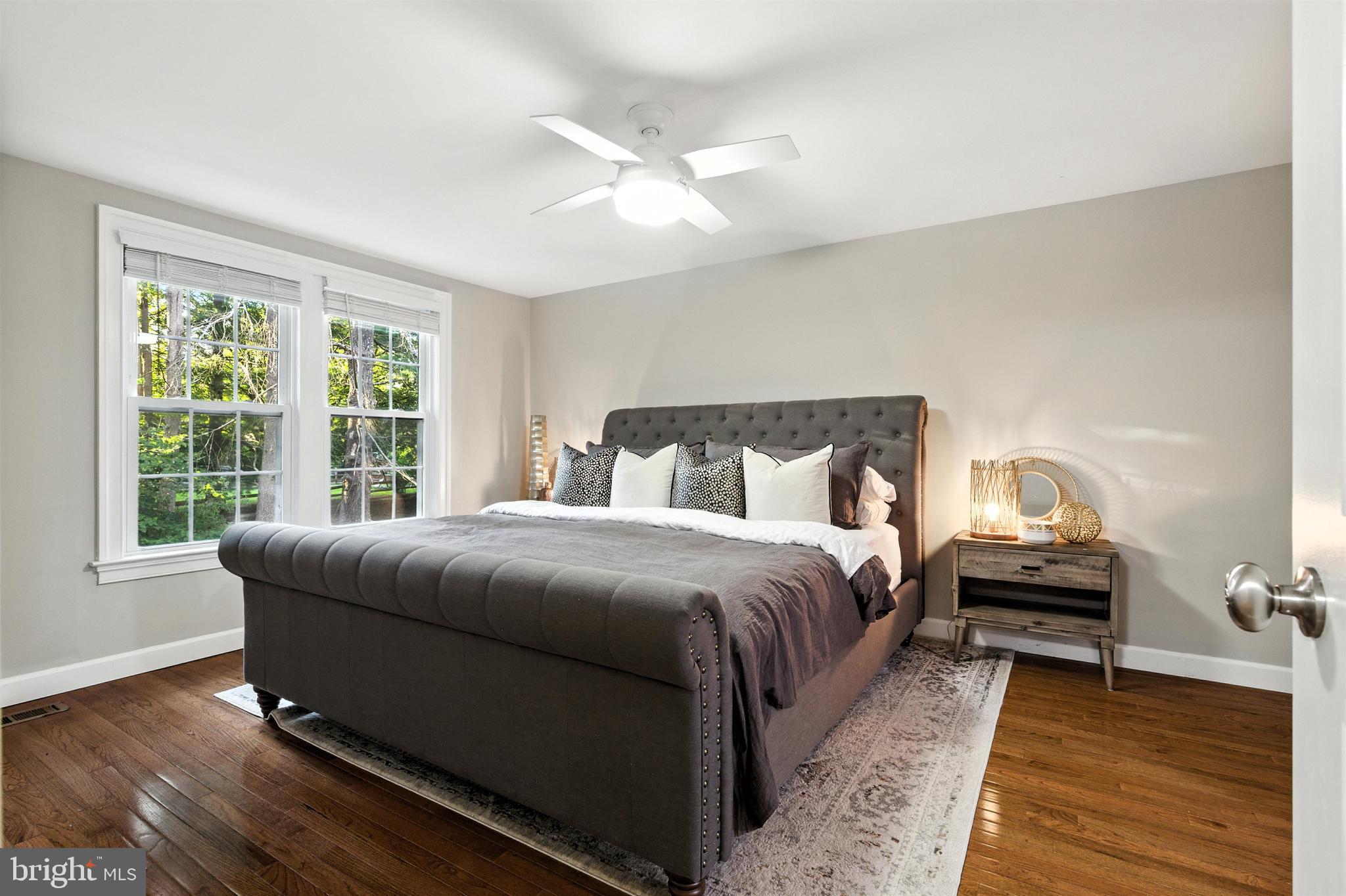 21804 Goshen School Road Gaithersburg, MD 20882 - Photo 21 of 37 a bedroom with a bed and wooden floor