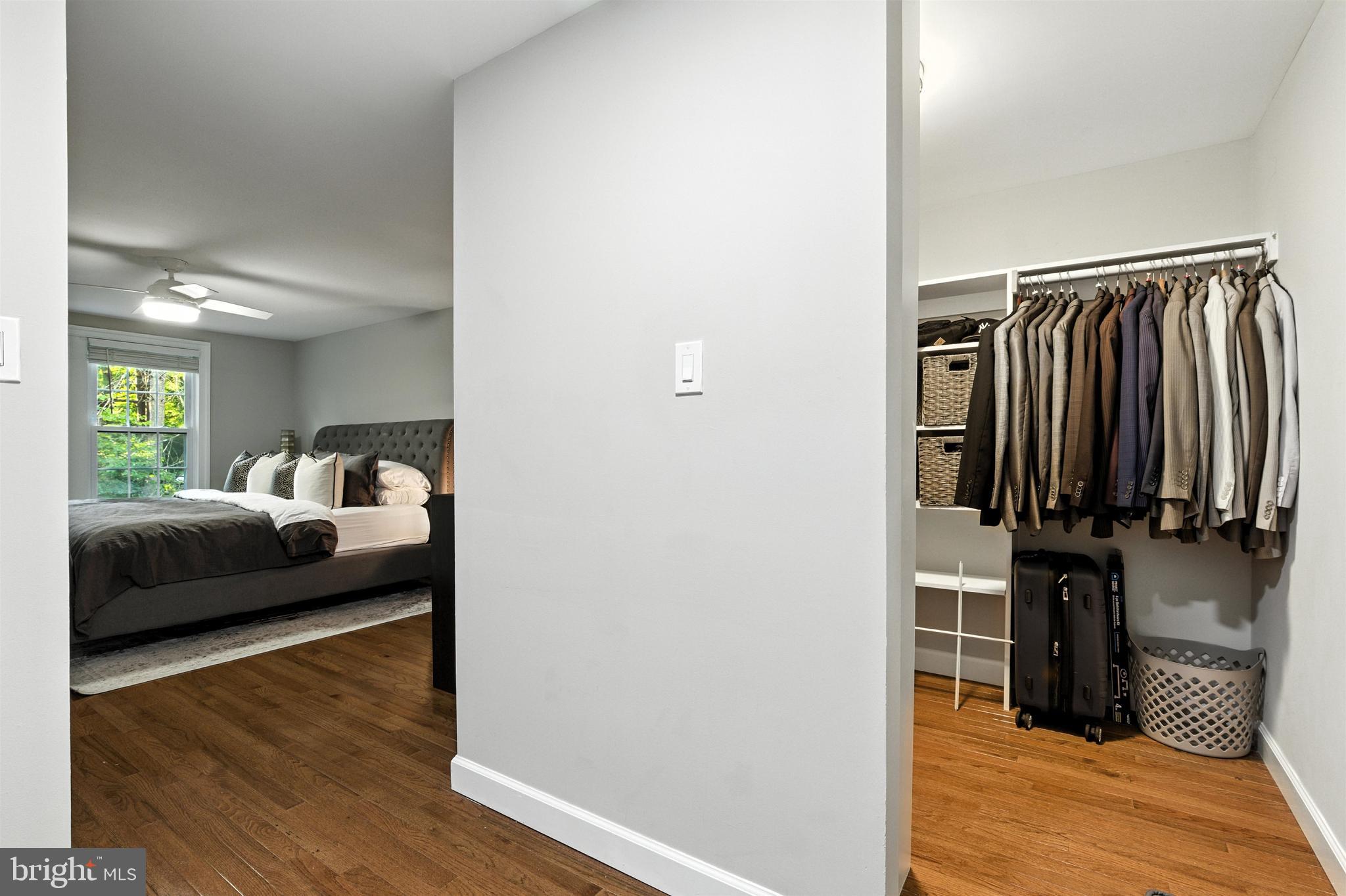 21804 Goshen School Road Gaithersburg, MD 20882 - Photo 25 of 37 a bedroom with a bed and wooden floor