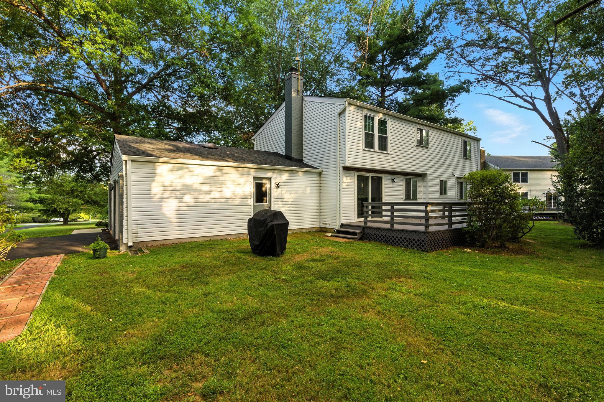 21804 Goshen School Road Gaithersburg, MD 20882 - Photo 32 of 37 a view of a house with backyard and a tree