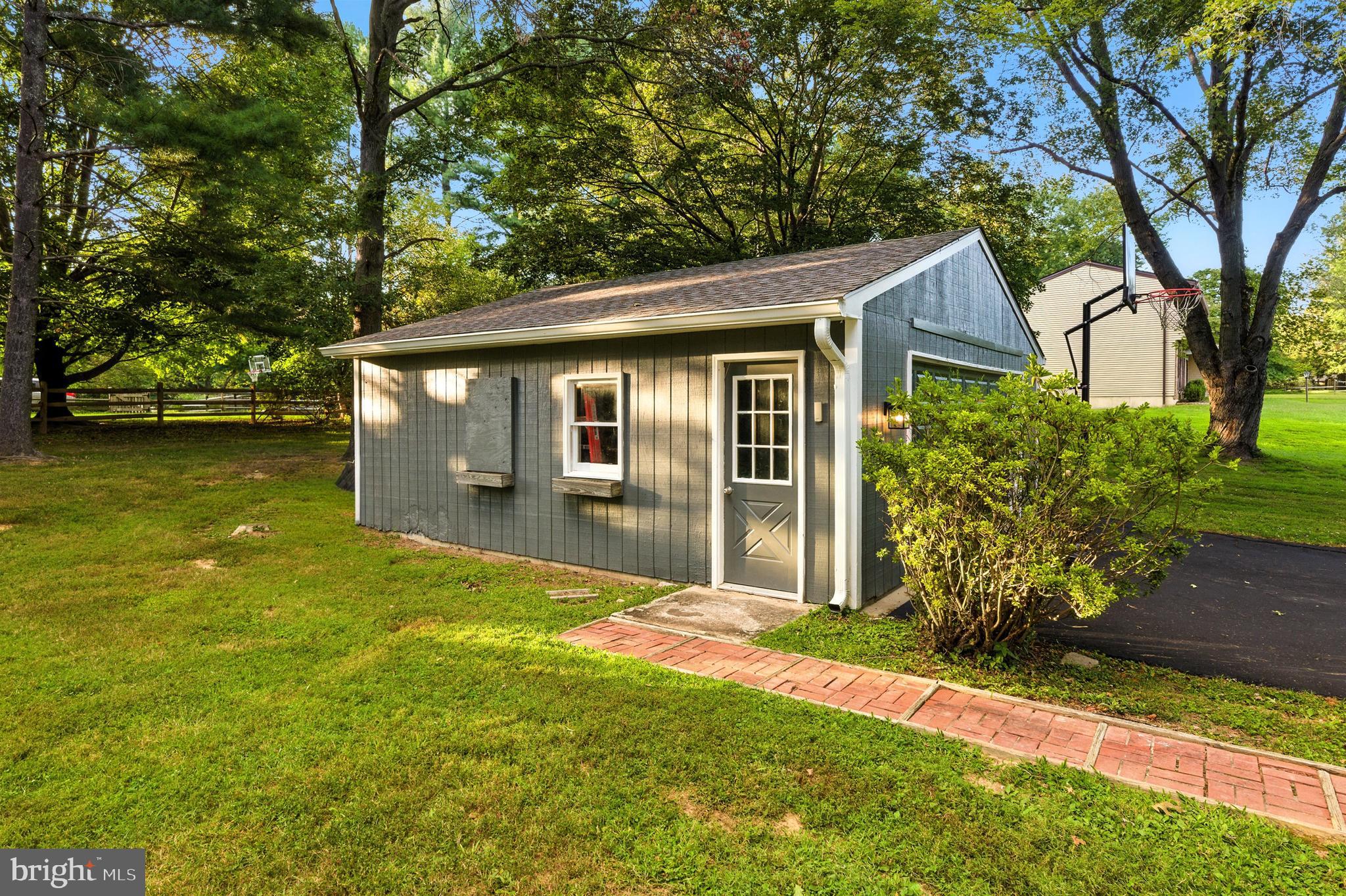 21804 Goshen School Road Gaithersburg, MD 20882 - Photo 34 of 37 a front view of house with yard and green space