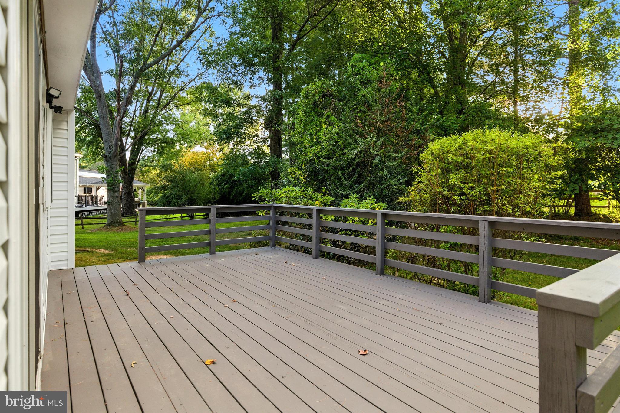 21804 Goshen School Road Gaithersburg, MD 20882 - Photo 36 of 37 a view of backyard with deck and wooden floor