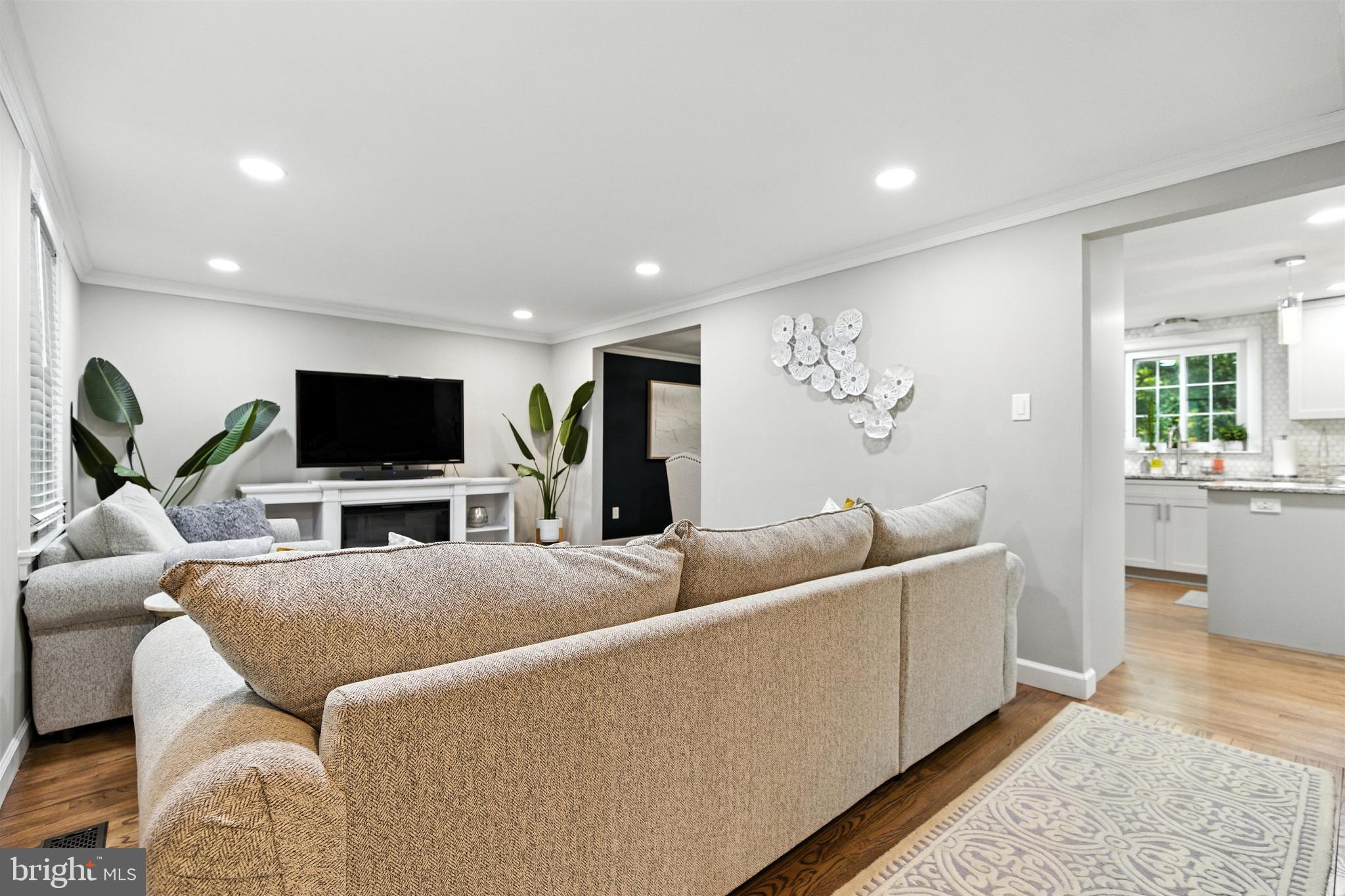 21804 Goshen School Road Gaithersburg, MD 20882 - Photo 4 of 37 a living room with furniture and a flat screen tv