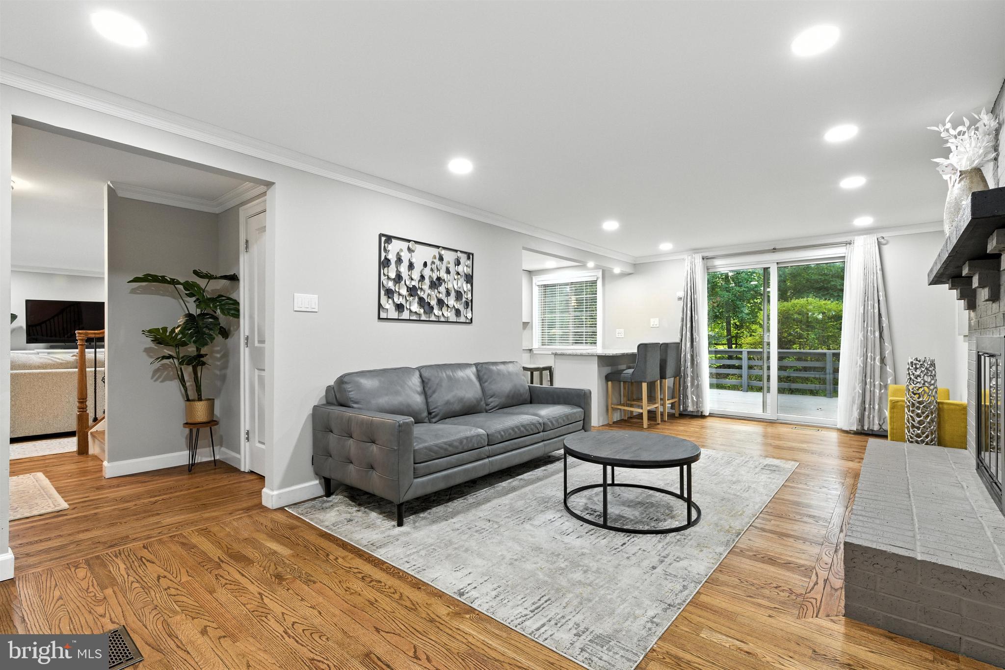 21804 Goshen School Road Gaithersburg, MD 20882 - Photo 6 of 37 a living room with furniture and a large window