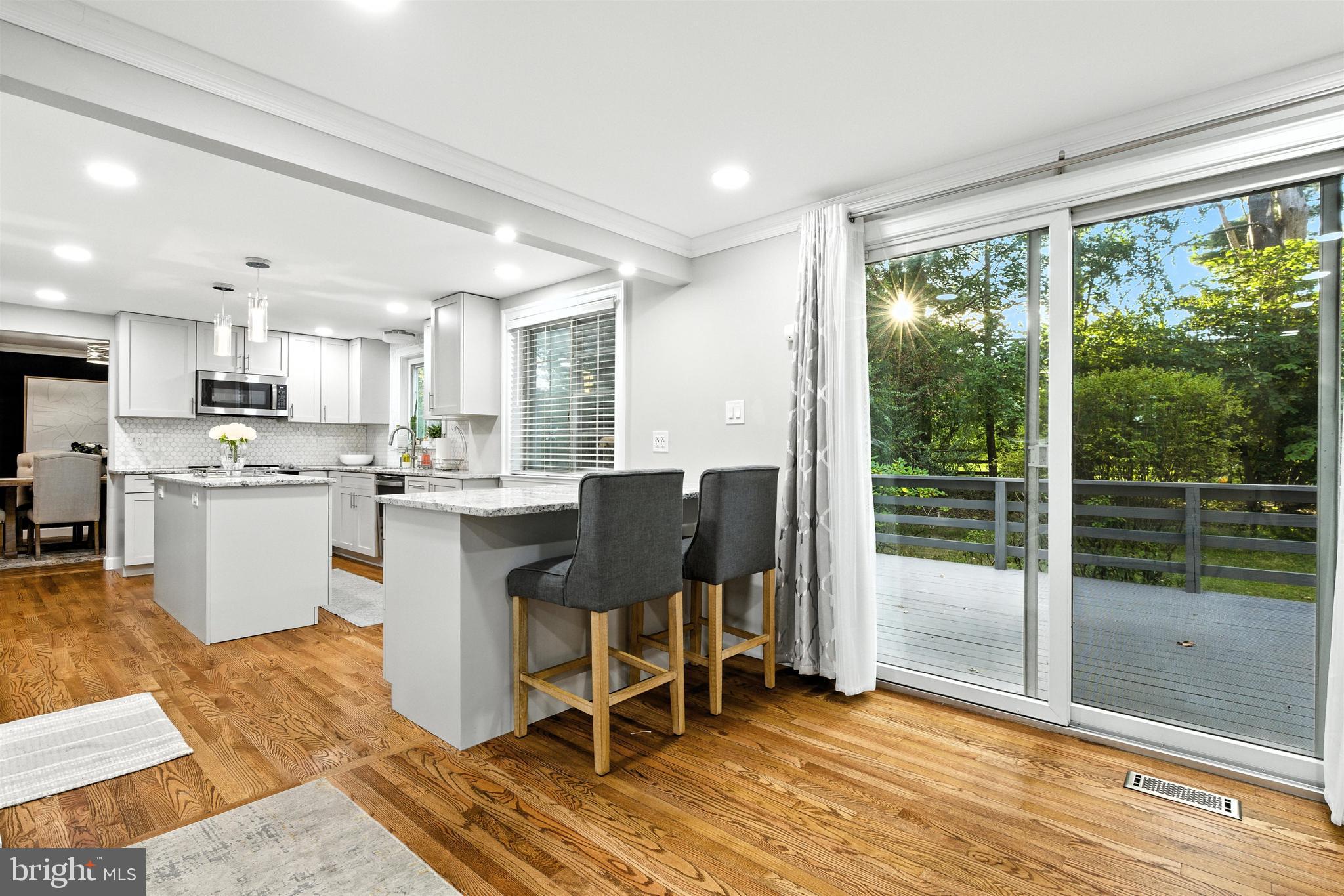 21804 Goshen School Road Gaithersburg, MD 20882 - Photo 8 of 37 a living room with a patio furniture and a wooden floor