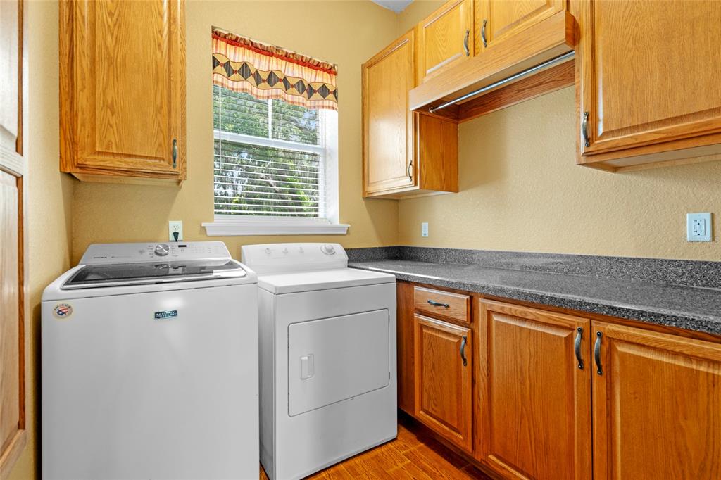 4405 North Wilder Road Plant City, FL 33565 - Photo 15 of 78 a utility room with dryer and washer