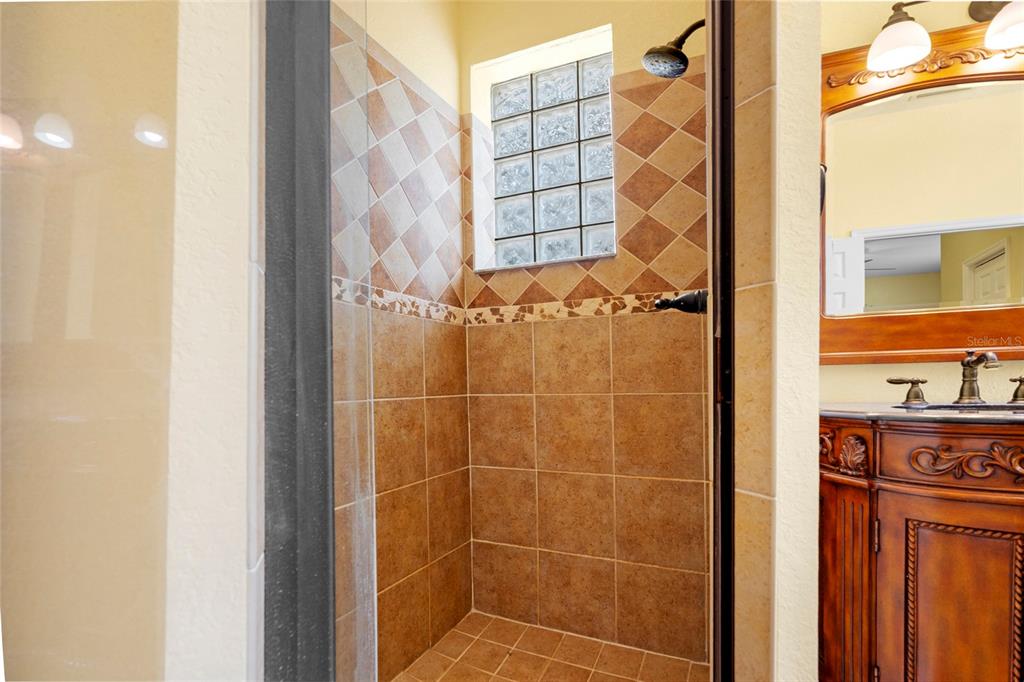 4405 North Wilder Road Plant City, FL 33565 - Photo 26 of 78 a bathroom with a bathtub and shower