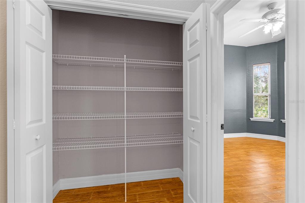 4405 North Wilder Road Plant City, FL 33565 - Photo 27 of 78 a view of walk in closet with empty racks