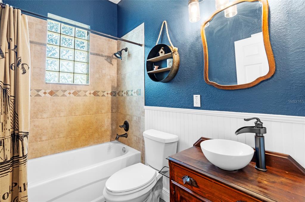 4405 North Wilder Road Plant City, FL 33565 - Photo 36 of 78 a bathroom with a toilet and a sink