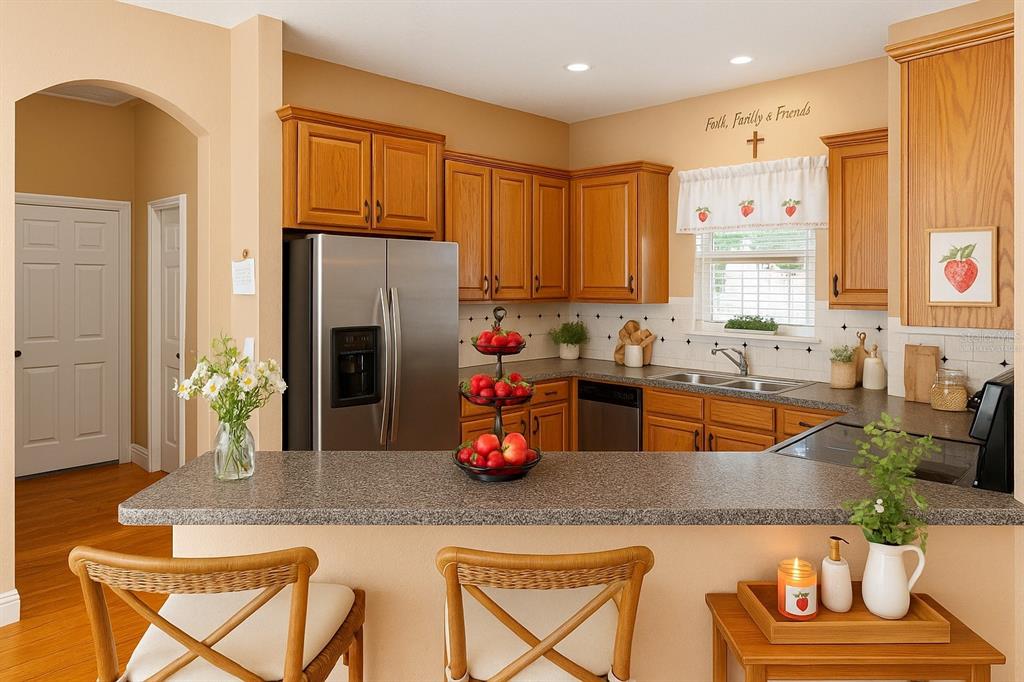 4405 North Wilder Road Plant City, FL 33565 - Photo 47 of 78 a kitchen with counter top space cabinets and stainless steel appliances