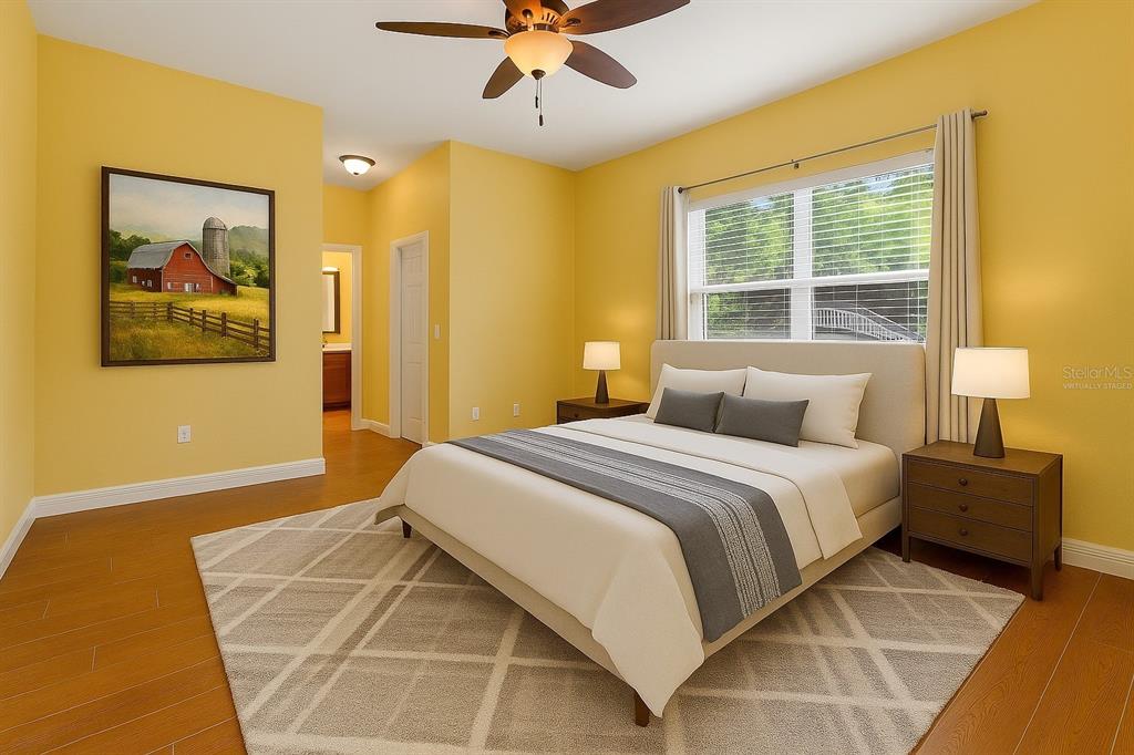 4405 North Wilder Road Plant City, FL 33565 - Photo 48 of 78 a bedroom with a bed and a painting on the wall