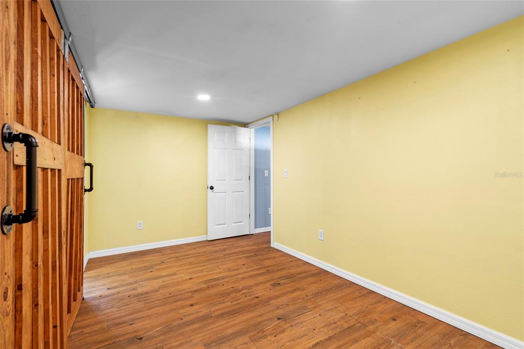4405 North Wilder Road Plant City, FL 33565 - Photo 64 of 78 a view of livingroom with wooden floor and a window