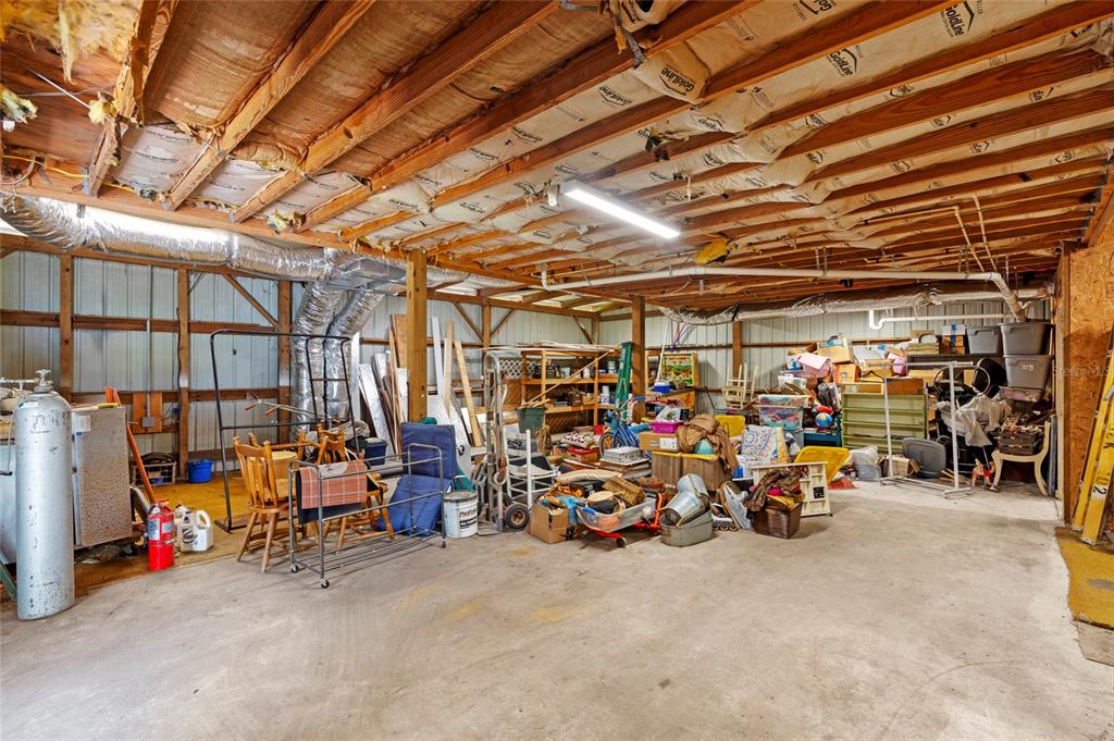 4405 North Wilder Road Plant City, FL 33565 - Photo 67 of 78 a view of a garage with rack and bicycle