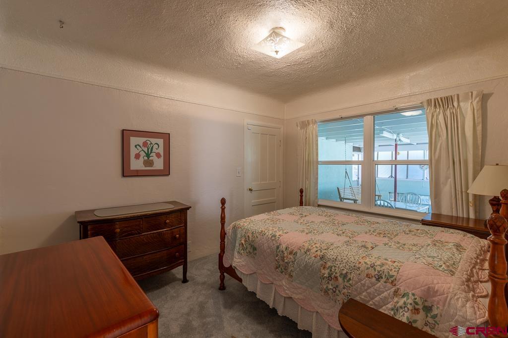 420 West 4th Street Cortez, CO 81321 - Photo 11 of 25 a bedroom with a bed and a window