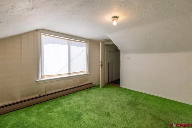 a view of a hallway with a door