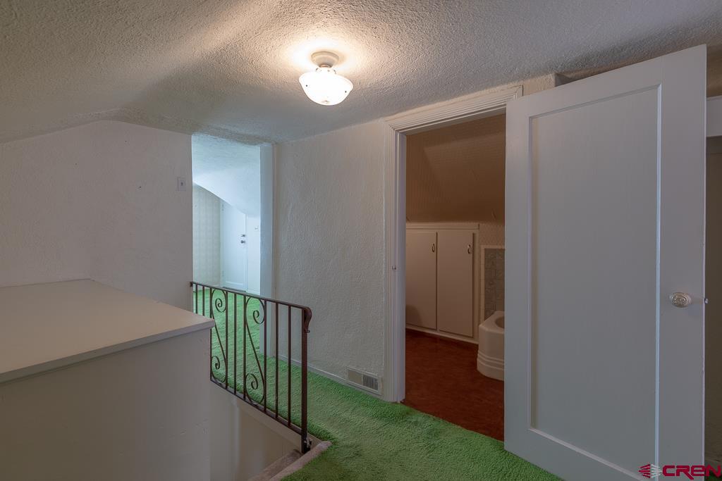 420 West 4th Street Cortez, CO 81321 - Photo 17 of 25 a view of a hallway with a door