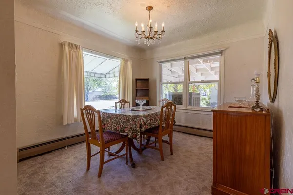 a view of a dining room with furniture window and outside view