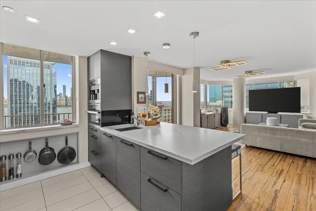 a kitchen with a stove a sink and a refrigerator