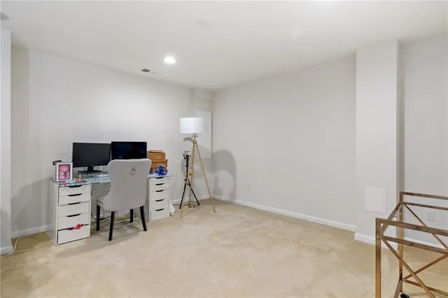 a workspace with furniture and a window