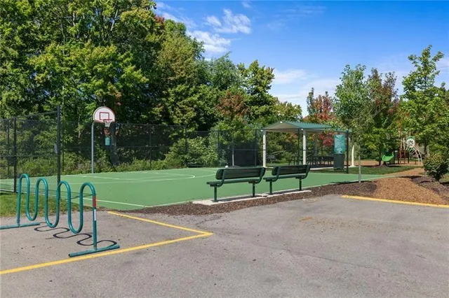 a view of a park with swings on the road