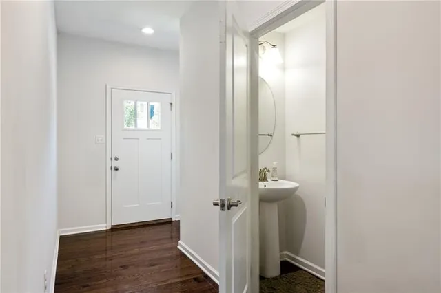 a view of a bathroom with wooden floor