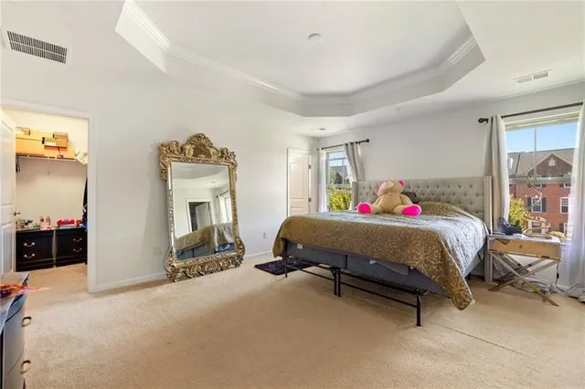 a bed room with a bed and a chair