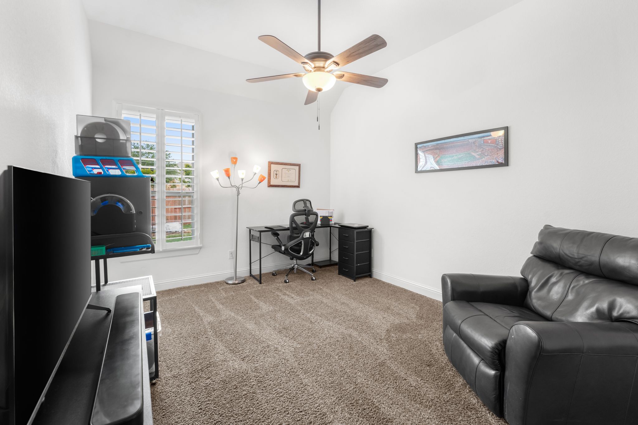 140 Waterloo Cove Georgetown, TX 78628 - Photo 25 of 40 A well-lit, private study with a window overlooking the backyard and plush carpeting underfoot.