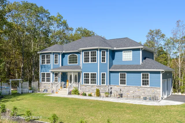 front view of a house with a yard