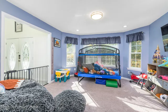 a bedroom with furniture and a bathtub