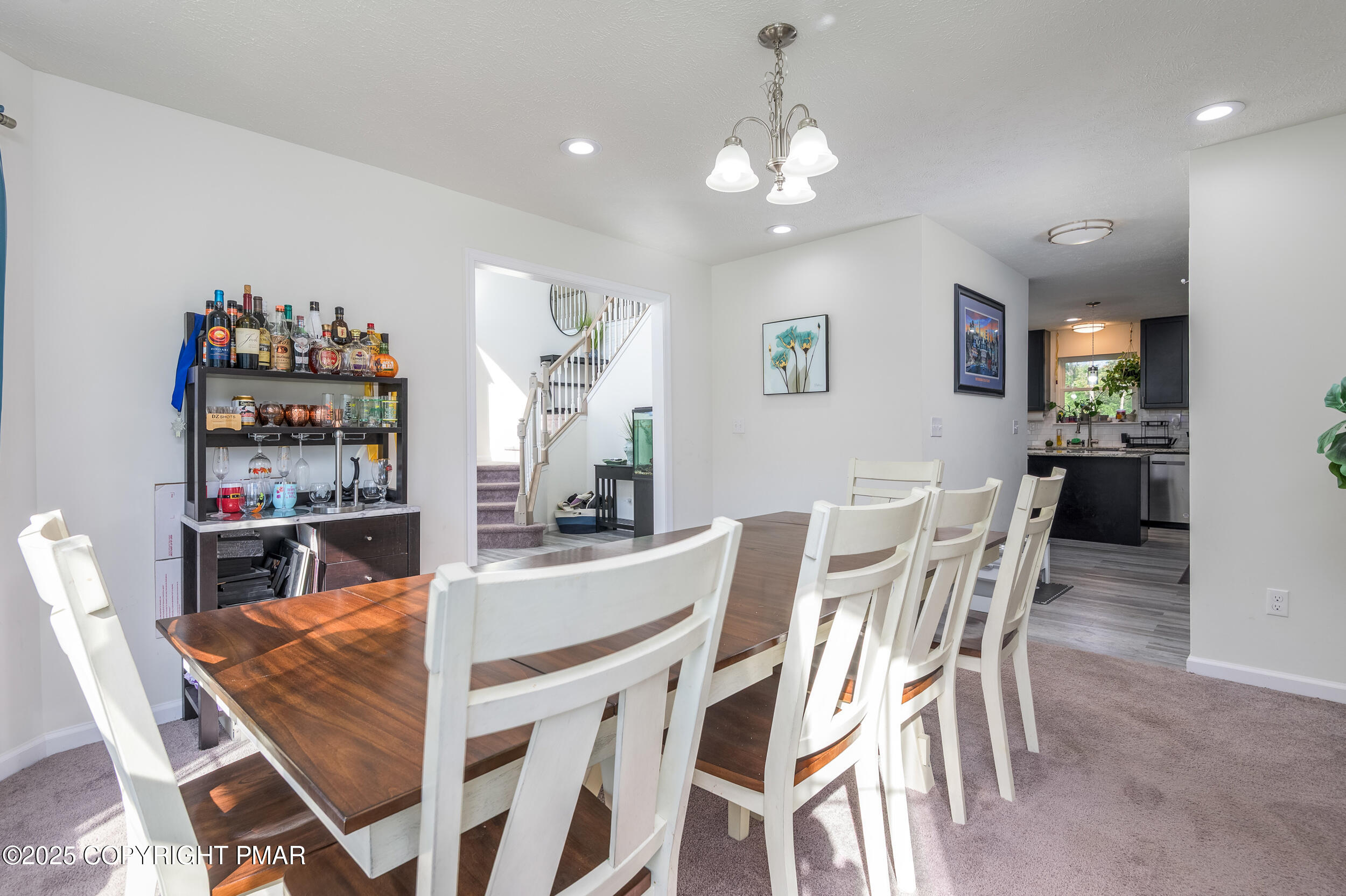 322 Russell Court Effort, PA 18330 - Photo 16 of 45 a view of a dining room with furniture and chandelier