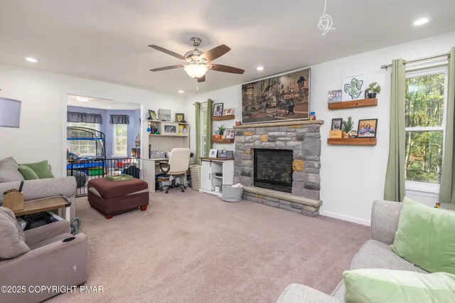 a living room with furniture and a fireplace