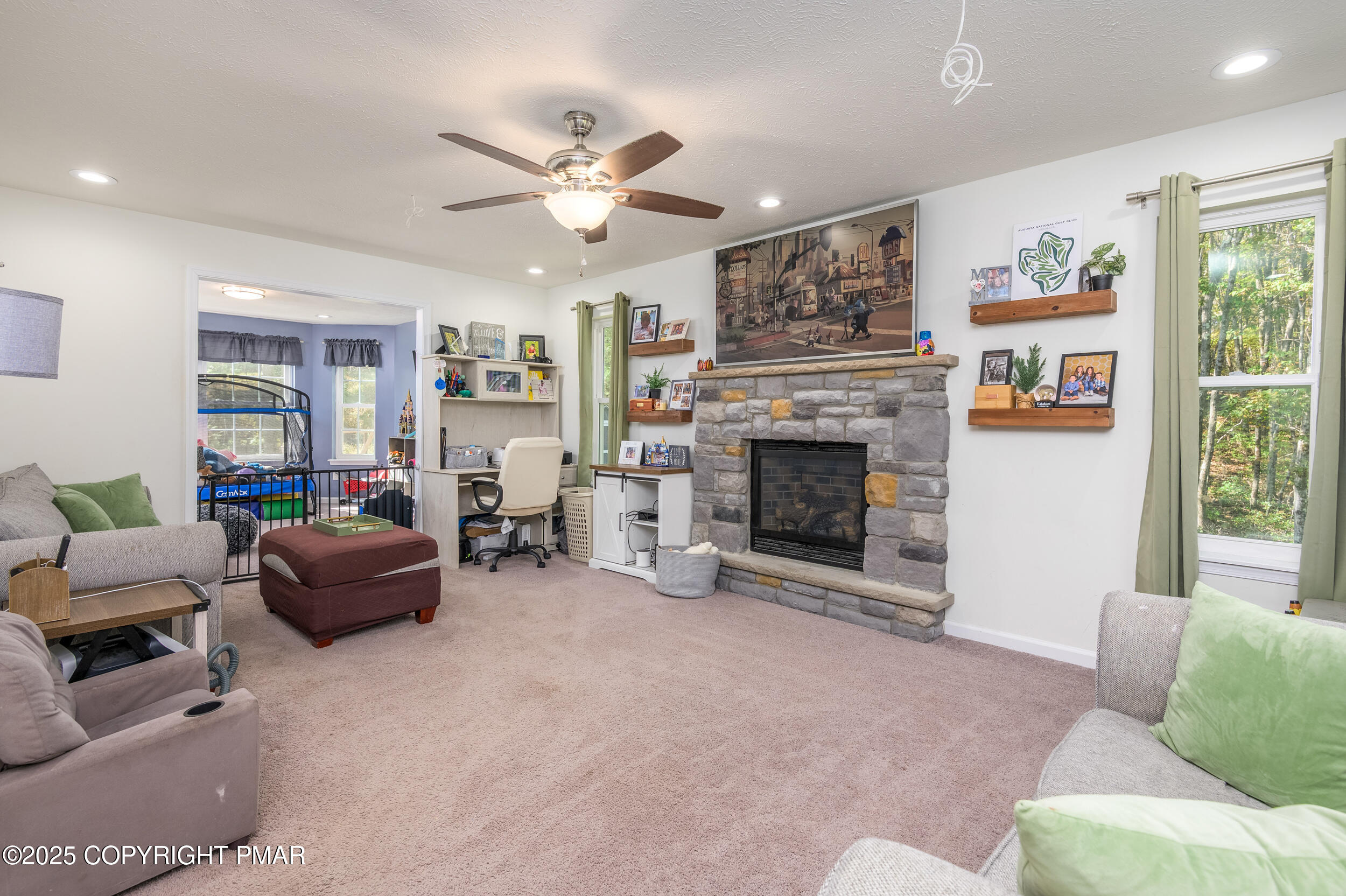 322 Russell Court Effort, PA 18330 - Photo 18 of 45 a living room with furniture and a fireplace