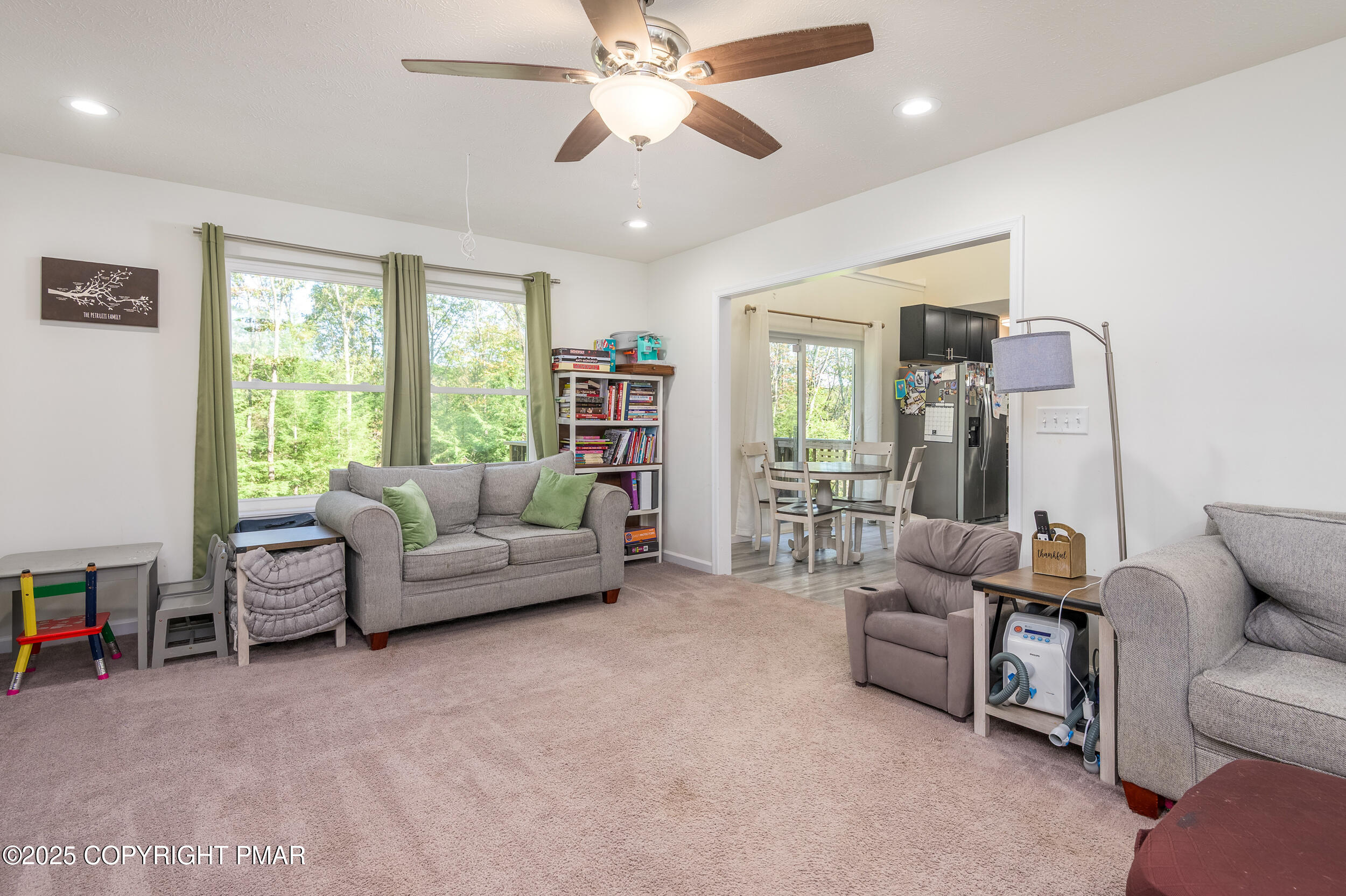322 Russell Court Effort, PA 18330 - Photo 19 of 45 a living room with furniture and a large window
