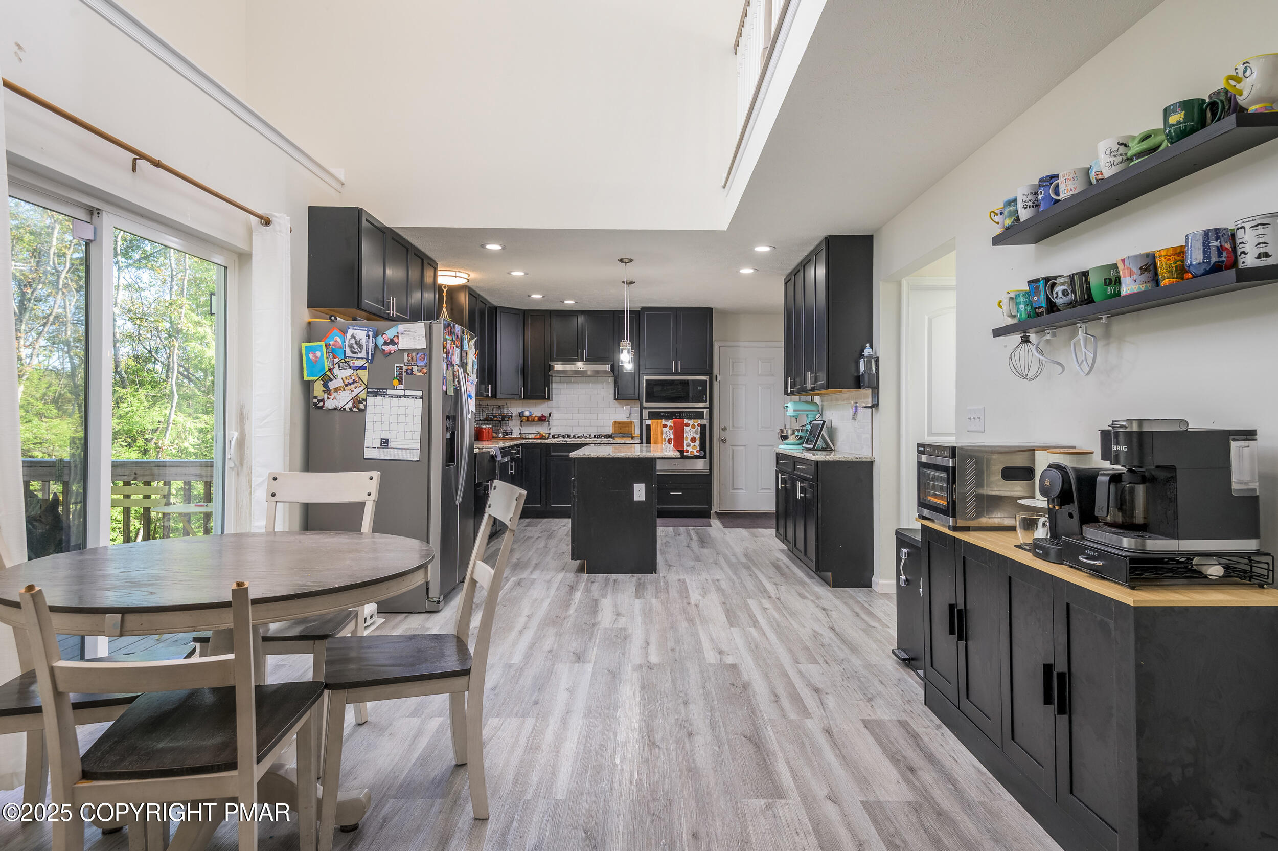 322 Russell Court Effort, PA 18330 - Photo 20 of 45 a kitchen with a table and chairs in it