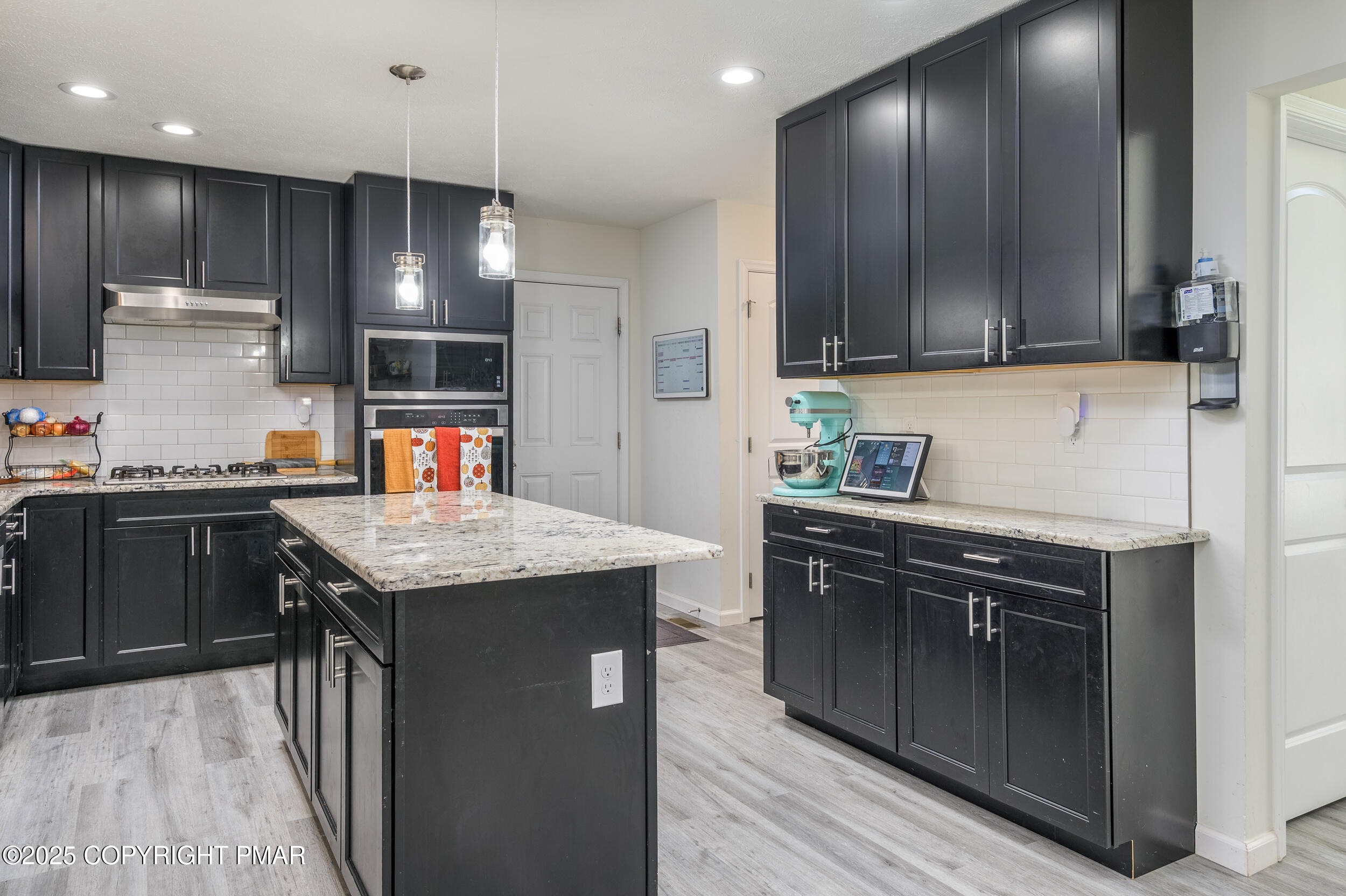 322 Russell Court Effort, PA 18330 - Photo 24 of 45 a kitchen with stainless steel appliances granite countertop wooden cabinets a sink and a stove