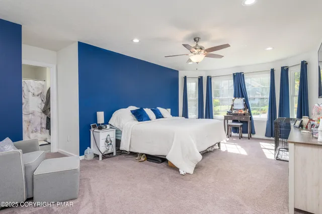 a bed room with a bed and a chandelier