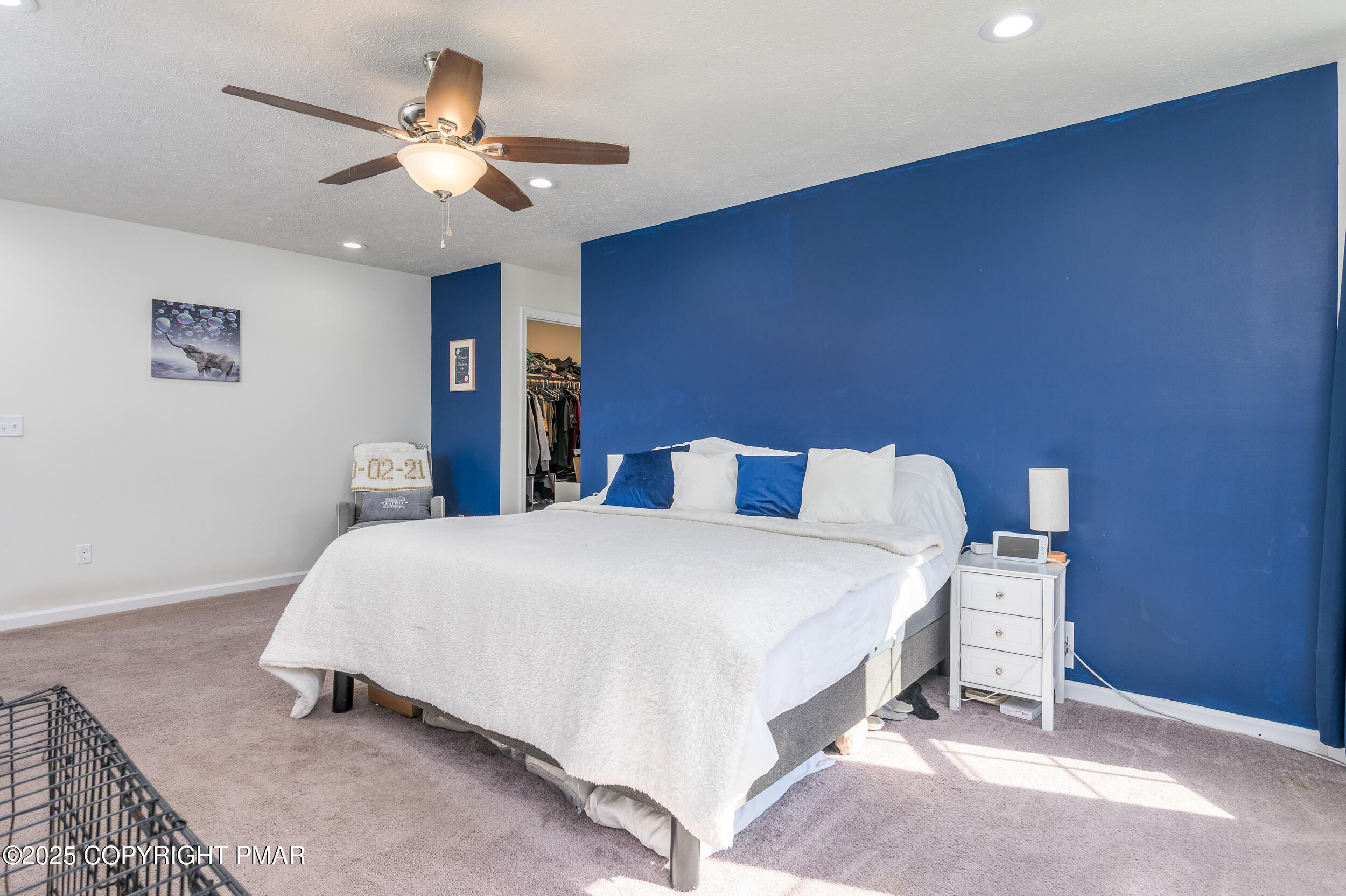 322 Russell Court Effort, PA 18330 - Photo 29 of 45 a bedroom with a bed and a chandelier