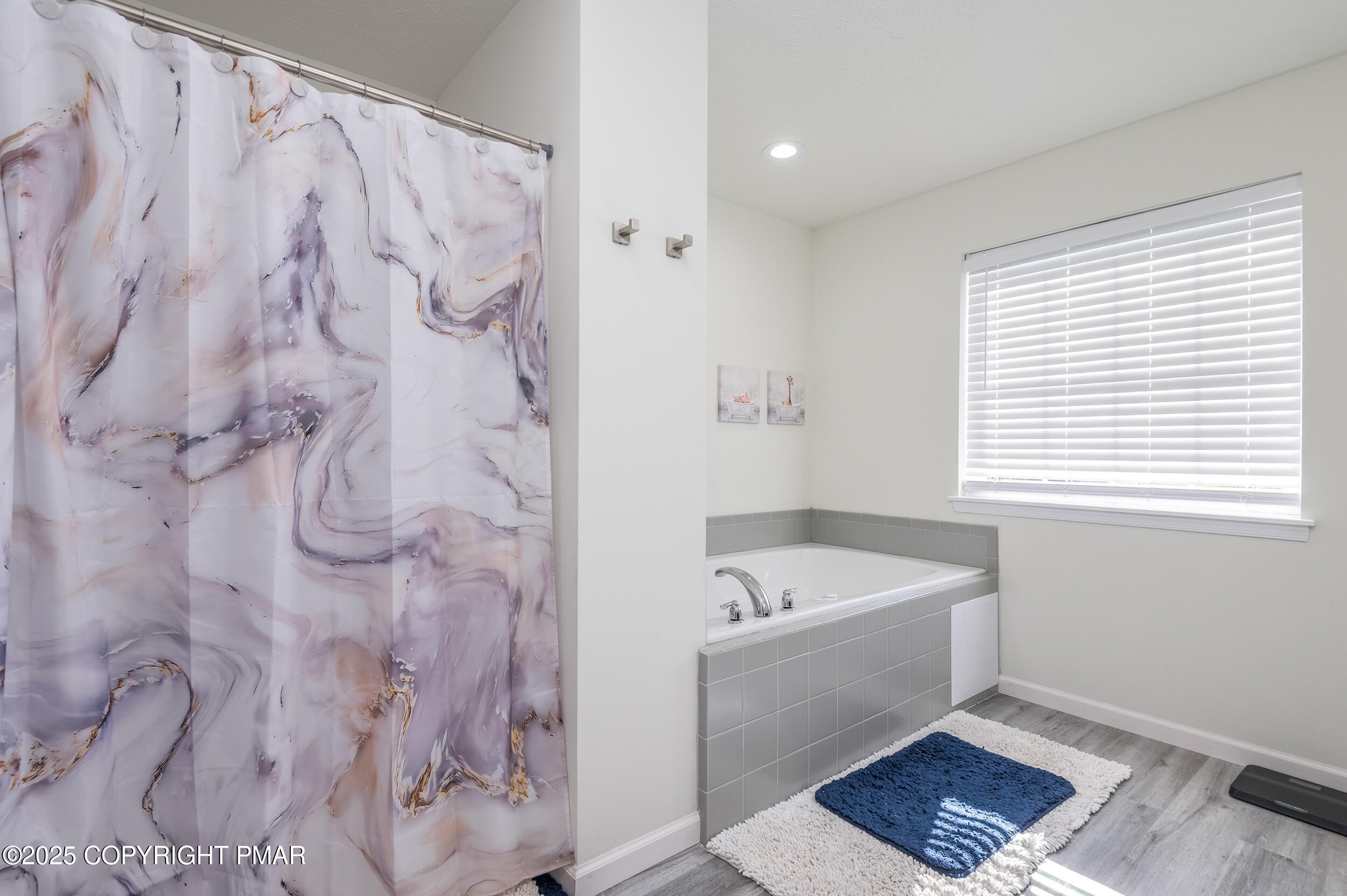 322 Russell Court Effort, PA 18330 - Photo 30 of 45 a bathroom with a bathtub and a shower