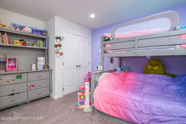 a bedroom with a bed and closet