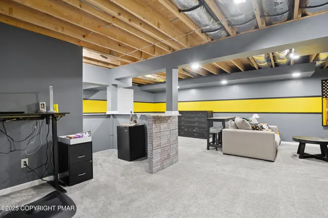 a room with furniture and pool table