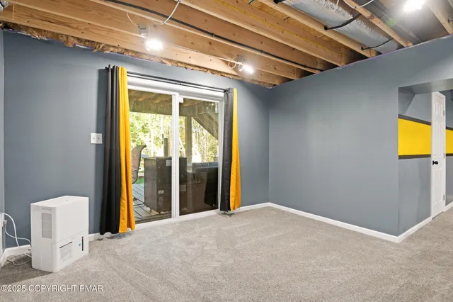 a view of a room with a large window