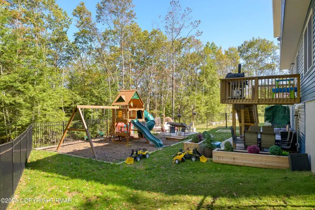 a view of a house with backyard porch and sitting area