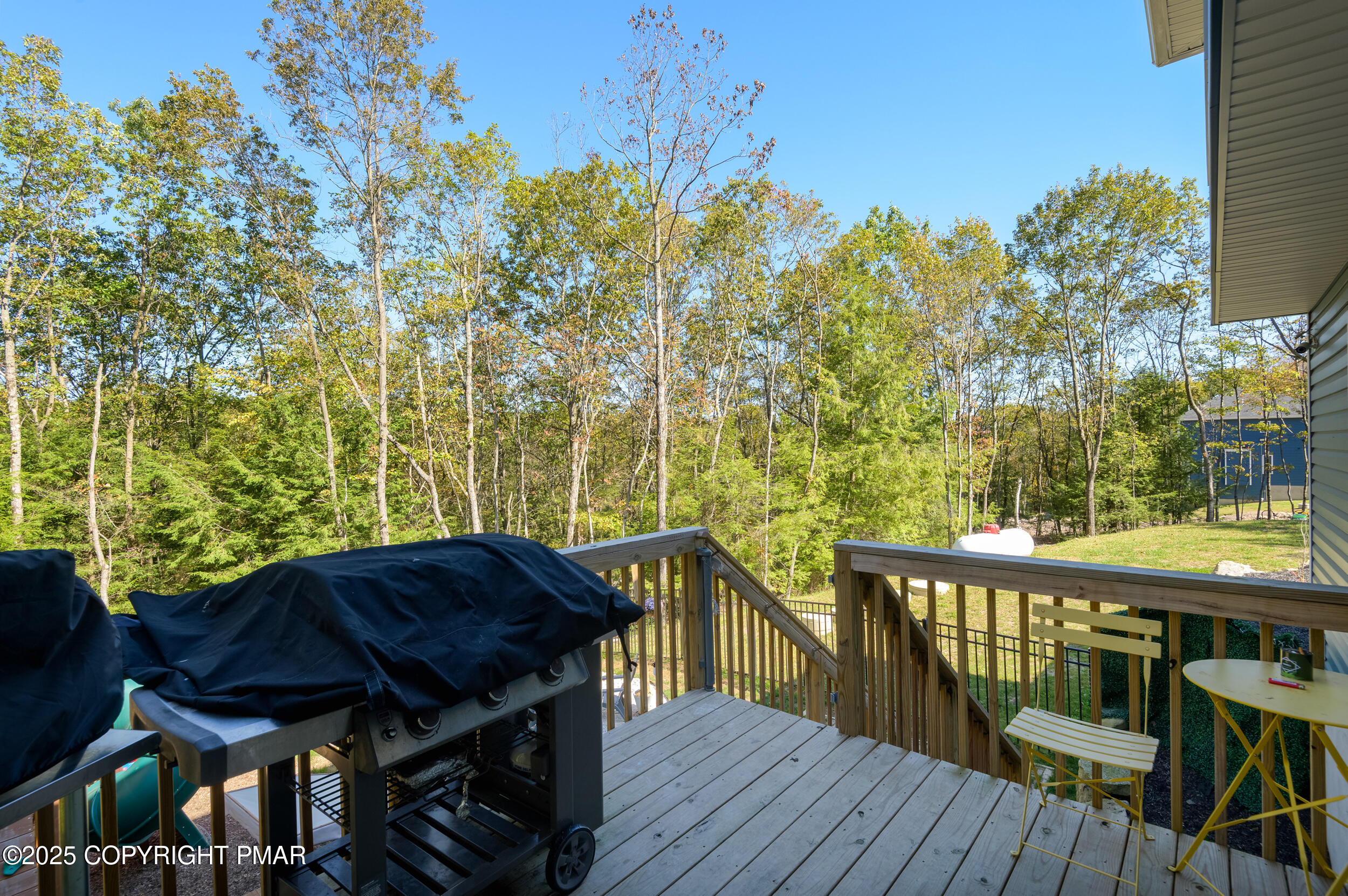 322 Russell Court Effort, PA 18330 - Photo 10 of 45 a view of a balcony with table and chairs and wooden floor