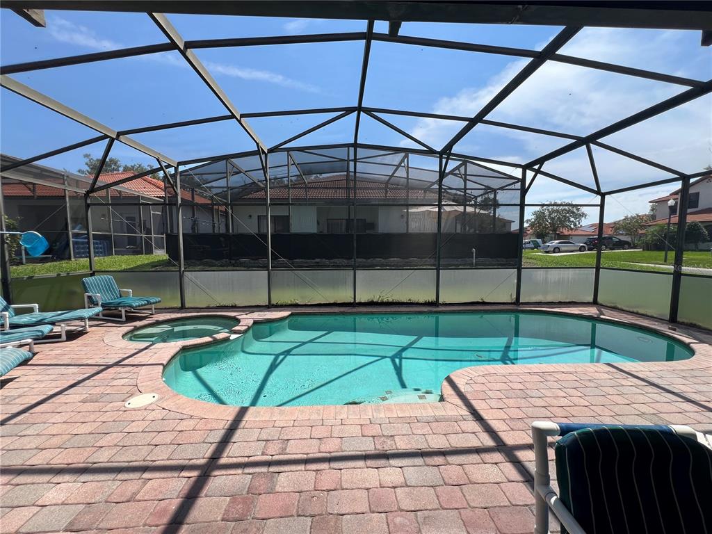 102 Sandy Point Way Clermont, FL 34714 - Photo 25 of 33 a view of a backyard with sitting area