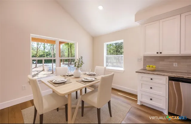 a dining room with furniture and window