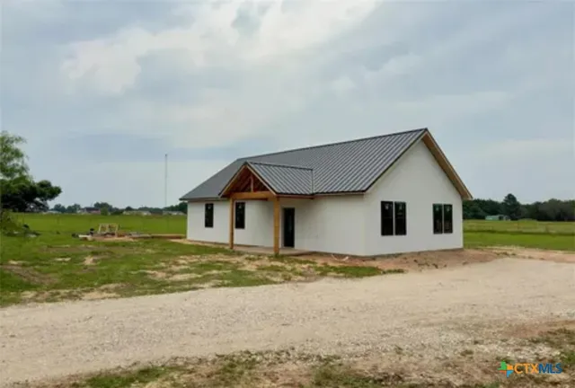 a house with yard in front of it