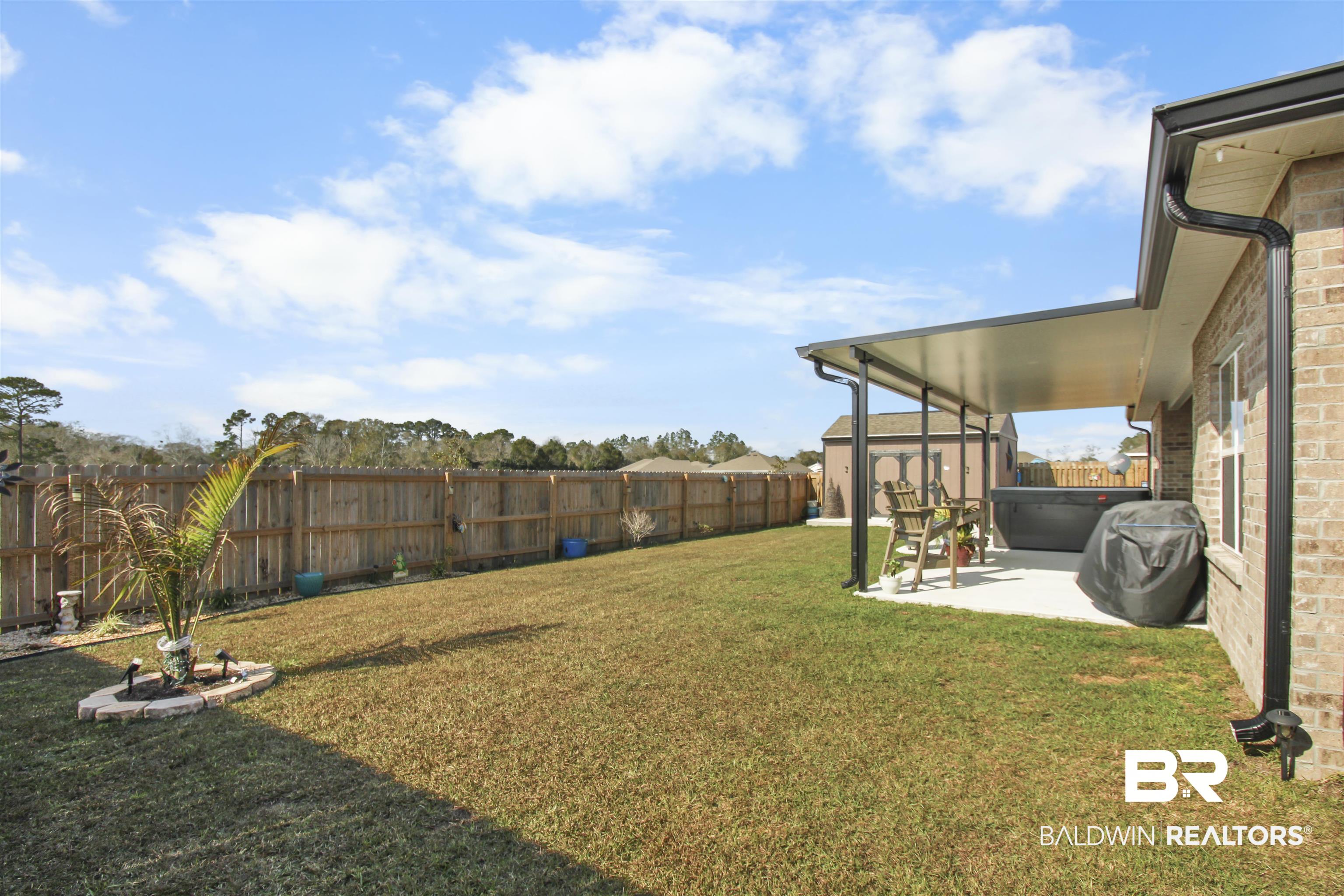 12523 Pheasant Run Elberta, AL 36530 - Photo 39 of 43 Fenced backyard with a patio area and a sunroom