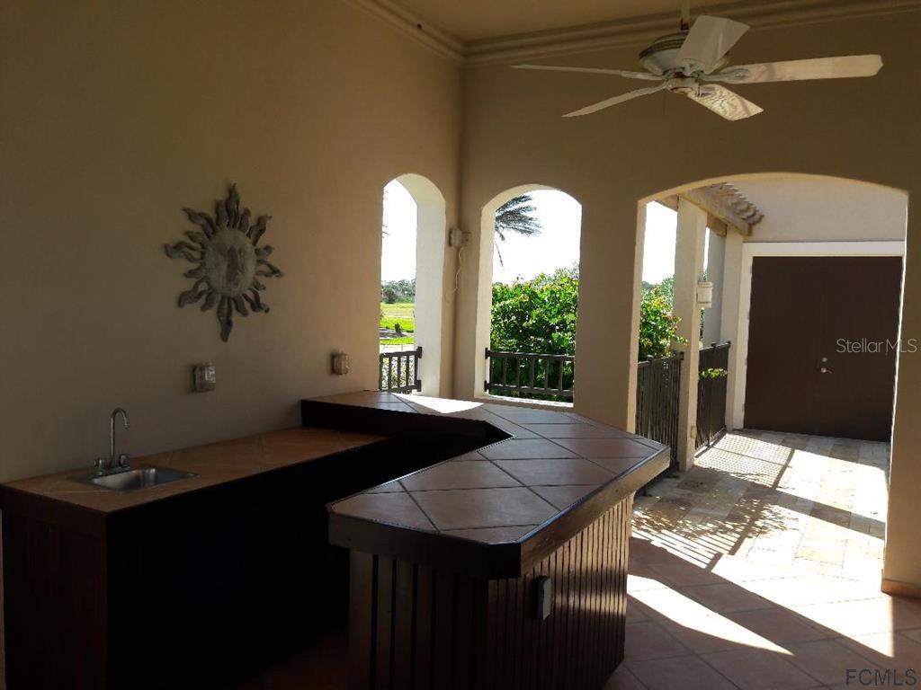 47 Shelter Cove Circle Beverly Beach, FL 32136 - Photo 14 of 21 a view of a livingroom with furniture and window