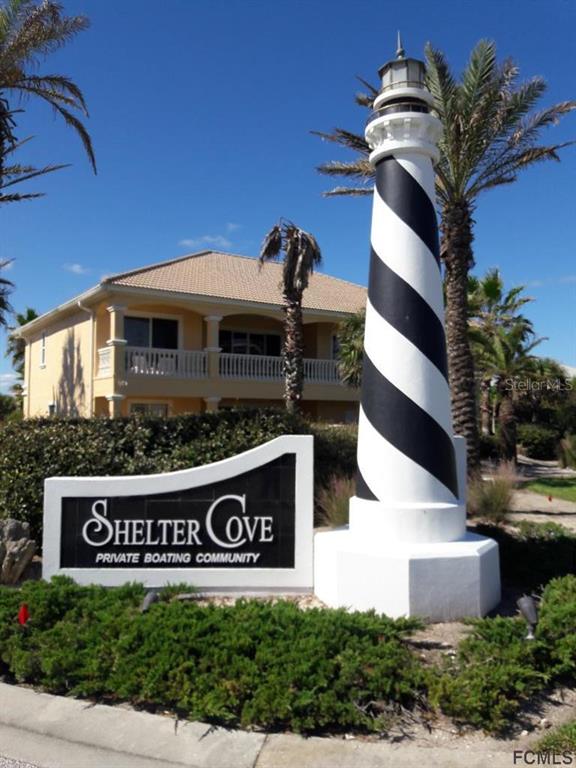 47 Shelter Cove Circle Beverly Beach, FL 32136 - Photo 9 of 21 a view of sign board with buildings in background